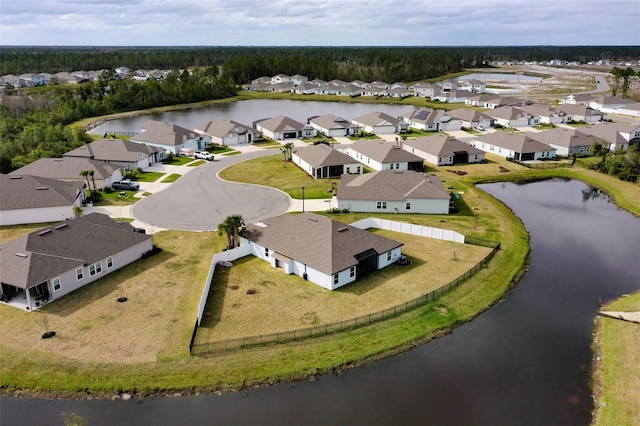 birds eye view of property with a residential view and a water view