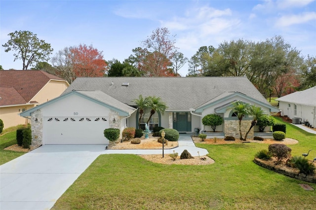 ranch-style home featuring central AC unit, a garage, concrete driveway, stone siding, and a front lawn