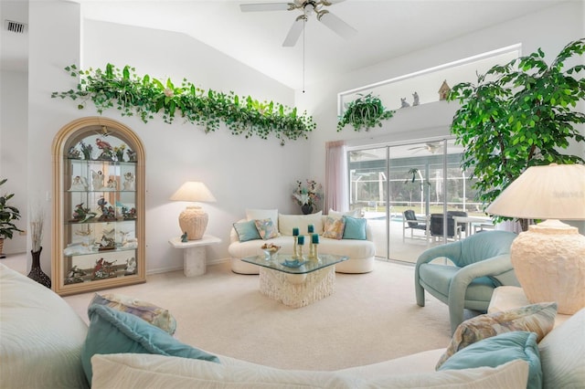 living room with high vaulted ceiling, carpet, visible vents, and a ceiling fan
