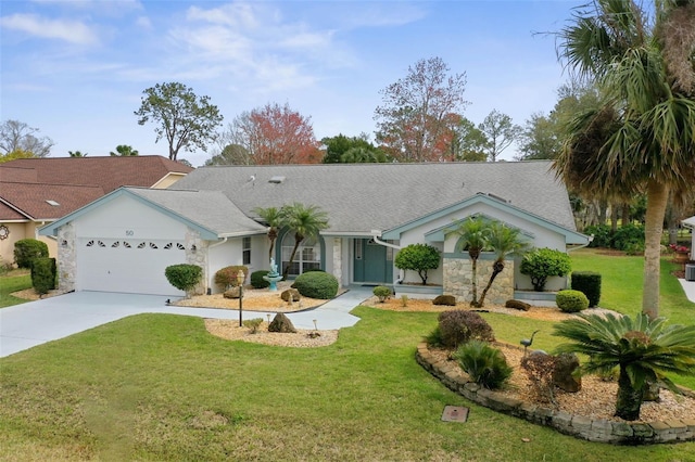 single story home with a front yard, concrete driveway, and an attached garage