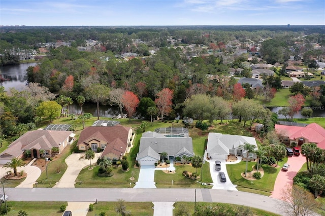 birds eye view of property featuring a water view and a residential view