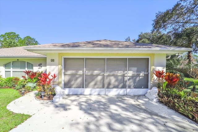 garage featuring driveway