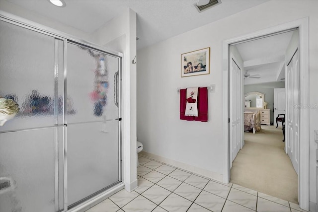 full bathroom with toilet, a stall shower, visible vents, and ensuite bathroom