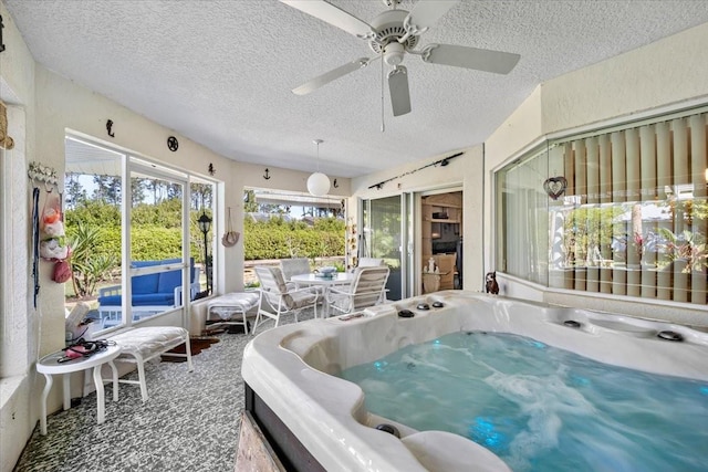 sunroom / solarium featuring a hot tub