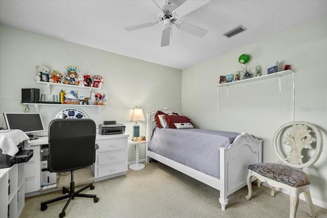 bedroom with ceiling fan, visible vents, baseboards, and light colored carpet