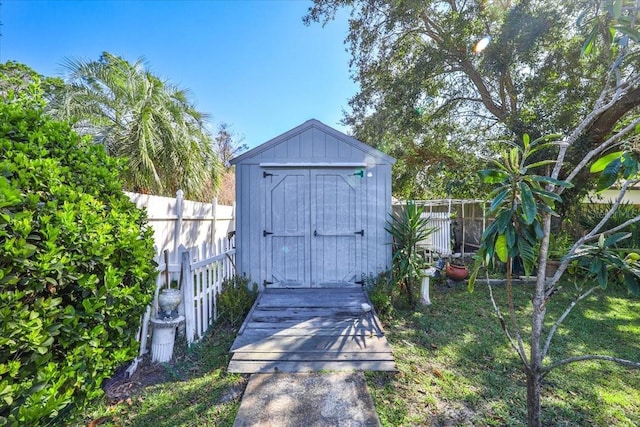 view of shed with a fenced backyard