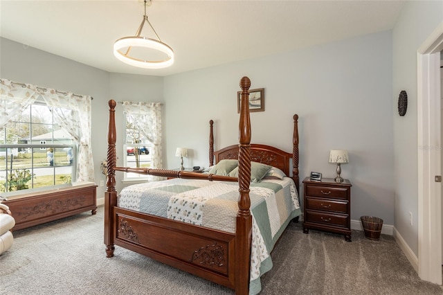 carpeted bedroom with baseboards