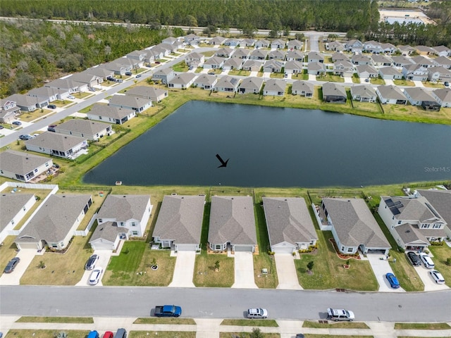 aerial view featuring a residential view and a water view