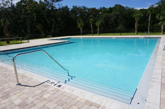 community pool with fence