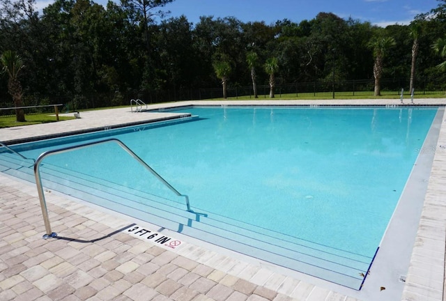 community pool featuring fence