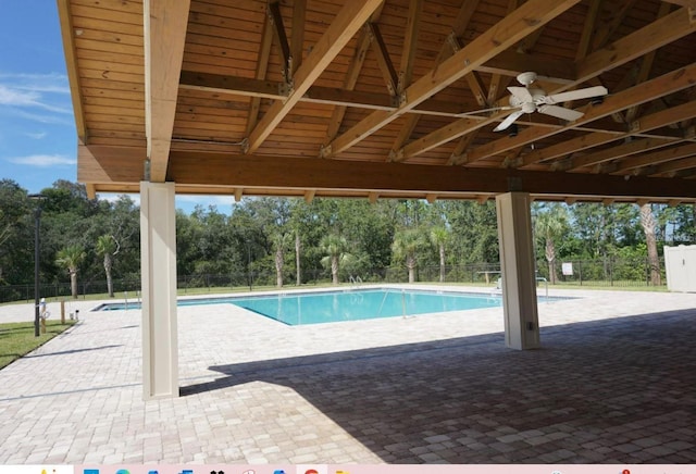 pool featuring ceiling fan, a patio, and fence