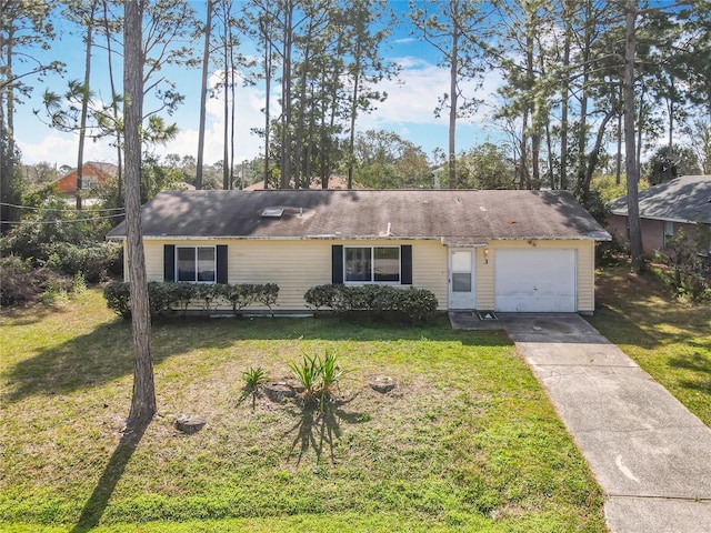 ranch-style house with a garage, driveway, and a front lawn