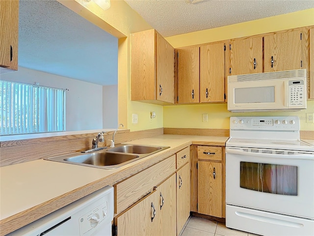 kitchen featuring light countertops, light tile patterned flooring, a sink, a textured ceiling, and white appliances