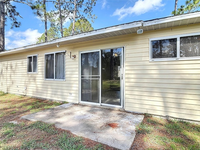 rear view of house featuring a patio