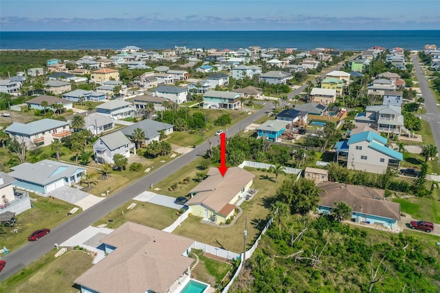 bird's eye view with a water view and a residential view