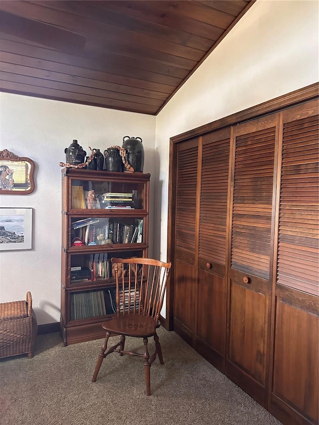 sitting room with lofted ceiling, carpet, and wooden ceiling