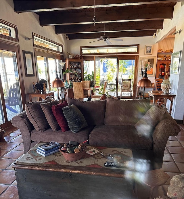 350 Lambert Ave, Flagler Beach, FL 32136 - living area featuring beam ceiling, a ceiling fan, and tile patterned flooring