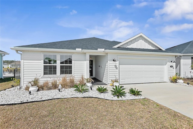 single story home featuring an attached garage, driveway, and board and batten siding