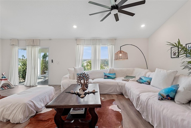 living room featuring ceiling fan, recessed lighting, wood finished floors, and a healthy amount of sunlight