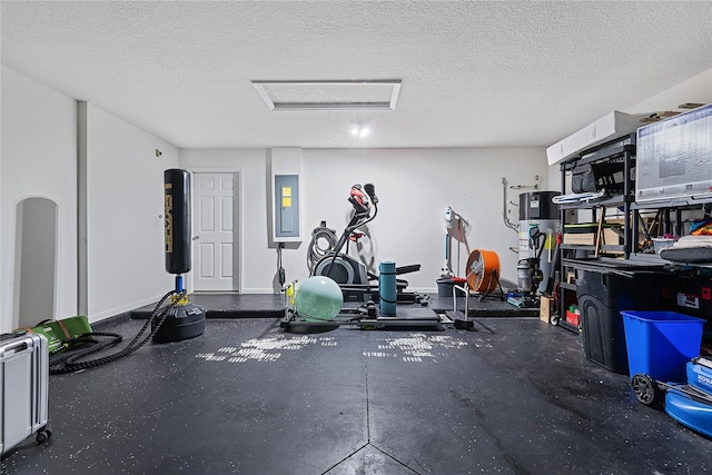 workout area featuring electric panel, baseboards, arched walkways, and a textured ceiling