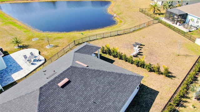 birds eye view of property with a water view