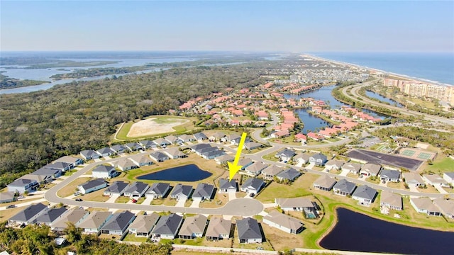 birds eye view of property featuring a residential view and a water view