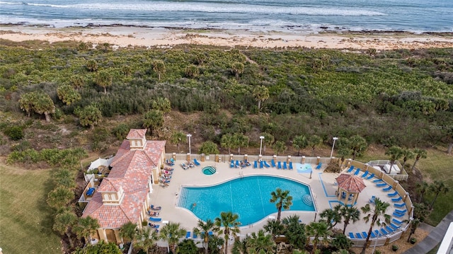 birds eye view of property featuring a view of the beach and a water view