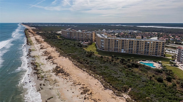 bird's eye view featuring a water view and a view of the beach