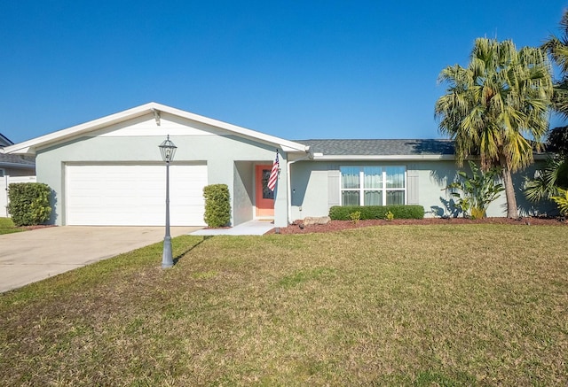 ranch-style home with a garage, driveway, a front lawn, and stucco siding