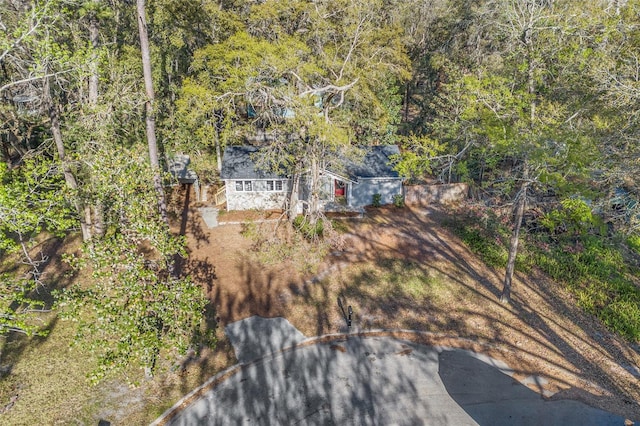 drone / aerial view featuring a view of trees