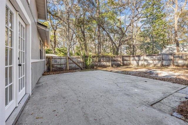 view of yard featuring a patio area and a fenced backyard