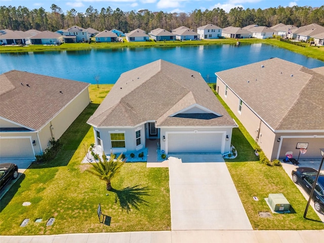 birds eye view of property featuring a water view and a residential view