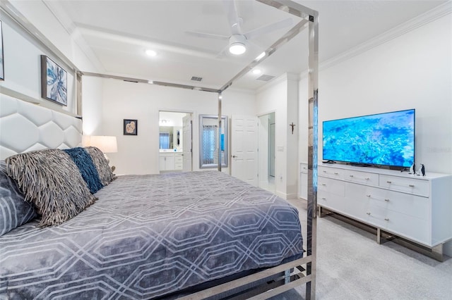 bedroom with visible vents, crown molding, ensuite bath, and ceiling fan