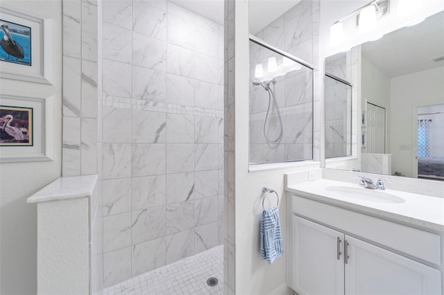 ensuite bathroom featuring a walk in shower, visible vents, ensuite bath, and vanity