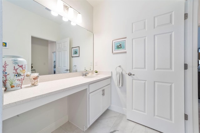 bathroom featuring vanity and baseboards