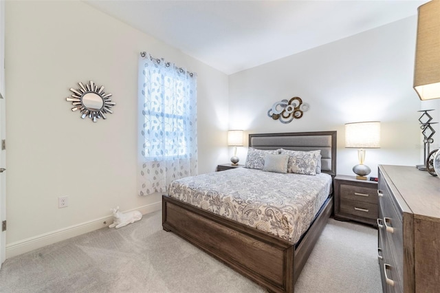 carpeted bedroom with baseboards