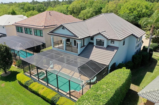 aerial view featuring a wooded view