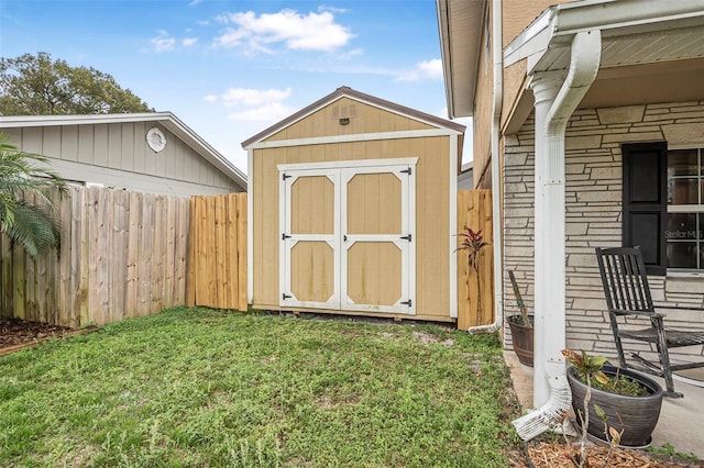 view of shed featuring a fenced backyard