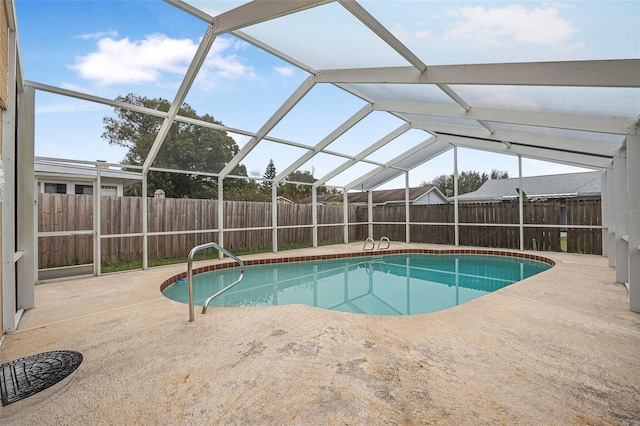 view of pool featuring a patio area, a fenced backyard, glass enclosure, and a fenced in pool