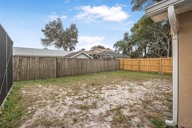 view of yard with a fenced backyard