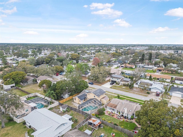 birds eye view of property with a residential view