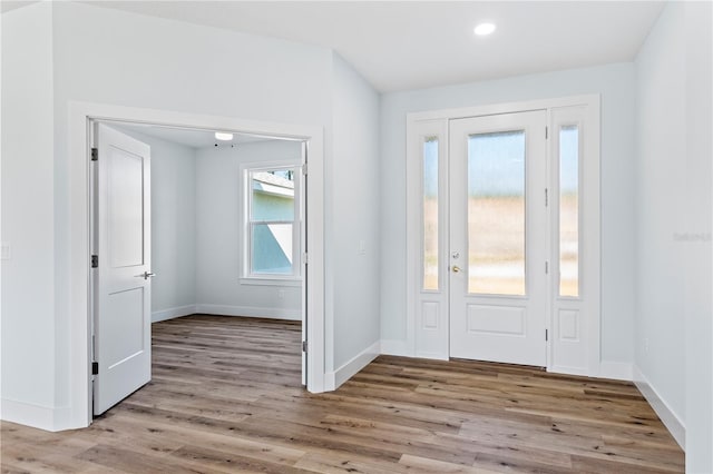 entryway with recessed lighting, baseboards, and wood finished floors