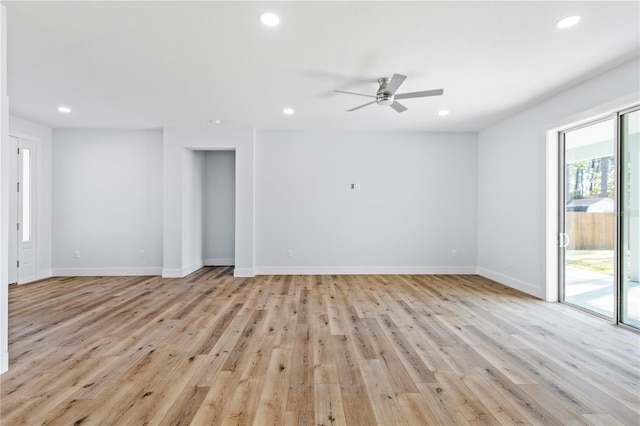 empty room featuring light wood-type flooring, recessed lighting, ceiling fan, and baseboards