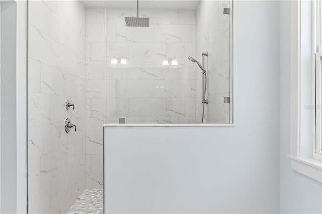 full bath featuring a marble finish shower