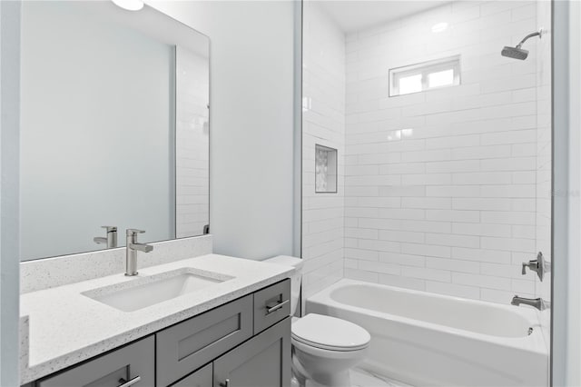 full bathroom featuring shower / bathing tub combination, vanity, and toilet