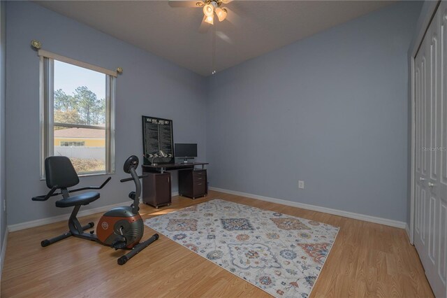 office with light wood finished floors, ceiling fan, and baseboards