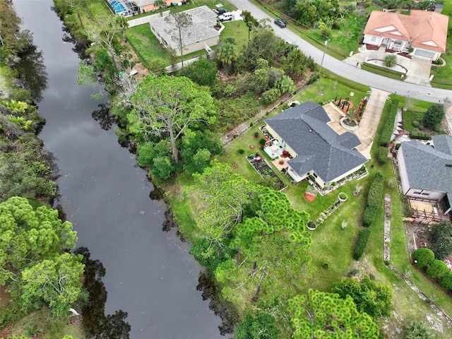 bird's eye view featuring a residential view and a water view