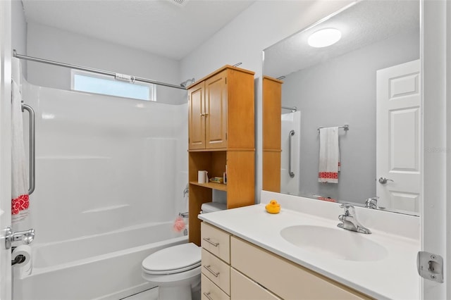 bathroom with tub / shower combination, vanity, and toilet