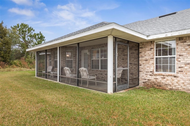 view of outdoor structure with a sunroom