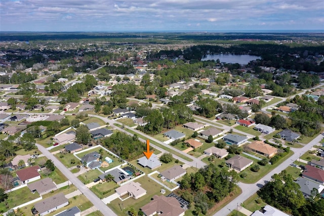 aerial view with a water view and a residential view